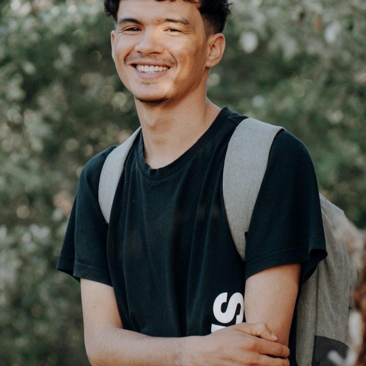 Mira Chen, Lead Design Curator at StreamGrainGarage, reviewing corporate floral arrangements